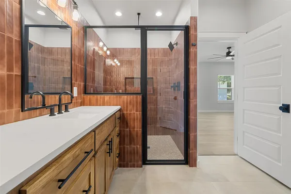 a bathroom with a sink and a shower