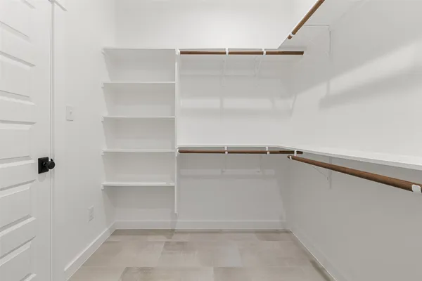 a view of an empty walk in closet