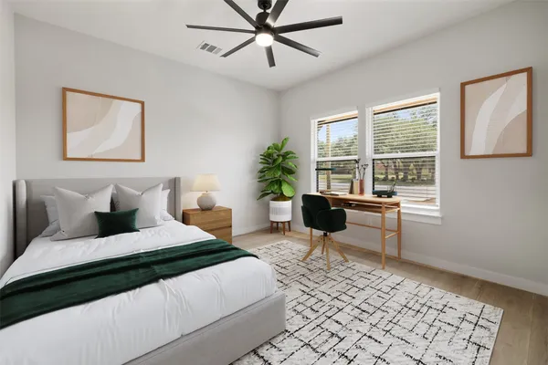 a bedroom with a bed and a table