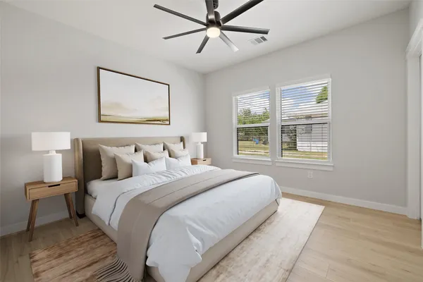 a bedroom with a bed and a window