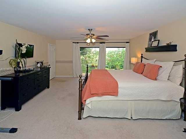 720 Mockingbird Lane Plantation, FL 33324 - Photo 11 of 12 a bedroom with a bed and window