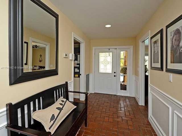 720 Mockingbird Lane Plantation, FL 33324 - Photo 2 of 12 a view of a hallway with a livingroom with furniture