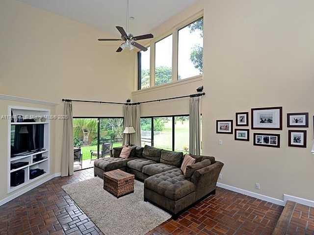 720 Mockingbird Lane Plantation, FL 33324 - Photo 6 of 12 a living room with furniture and a window