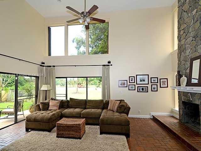 720 Mockingbird Lane Plantation, FL 33324 - Photo 7 of 12 a living room with furniture and a window