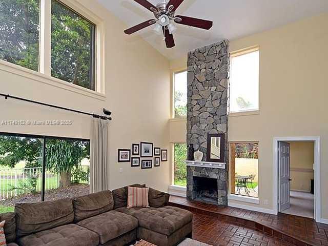 720 Mockingbird Lane Plantation, FL 33324 - Photo 8 of 12 a living room with furniture and a fireplace