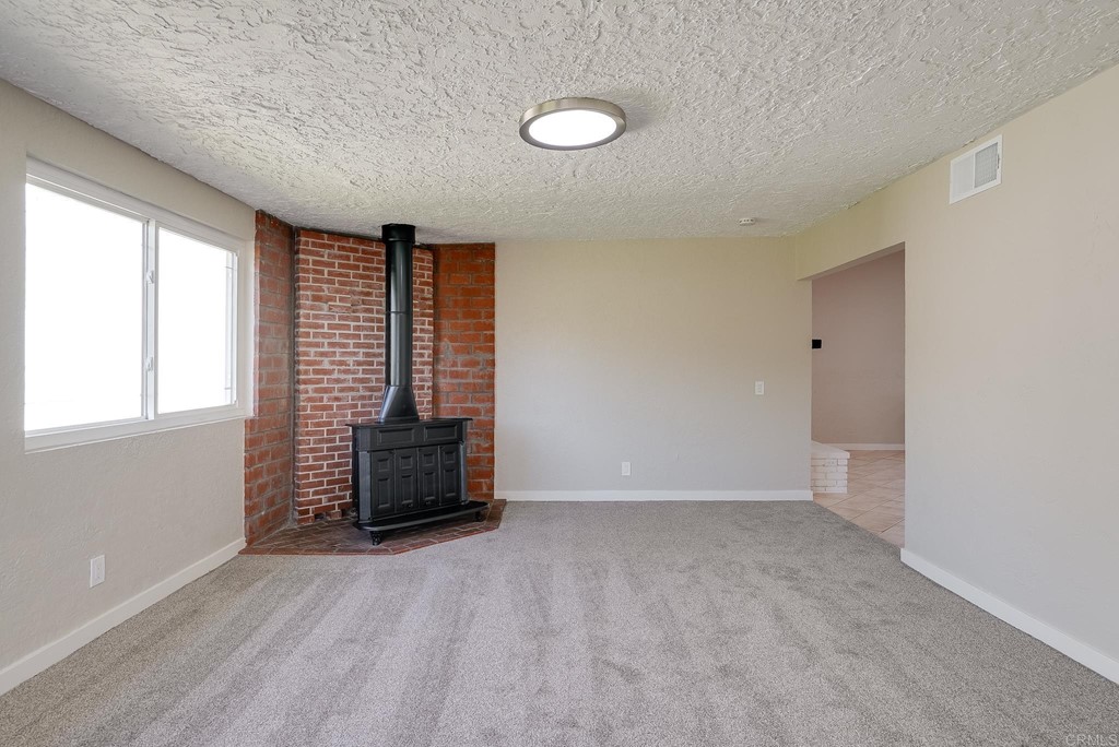 225 Hypoint Place Escondido, CA 92027 - Photo 21 of 63 wooden floor in an empty room with a window