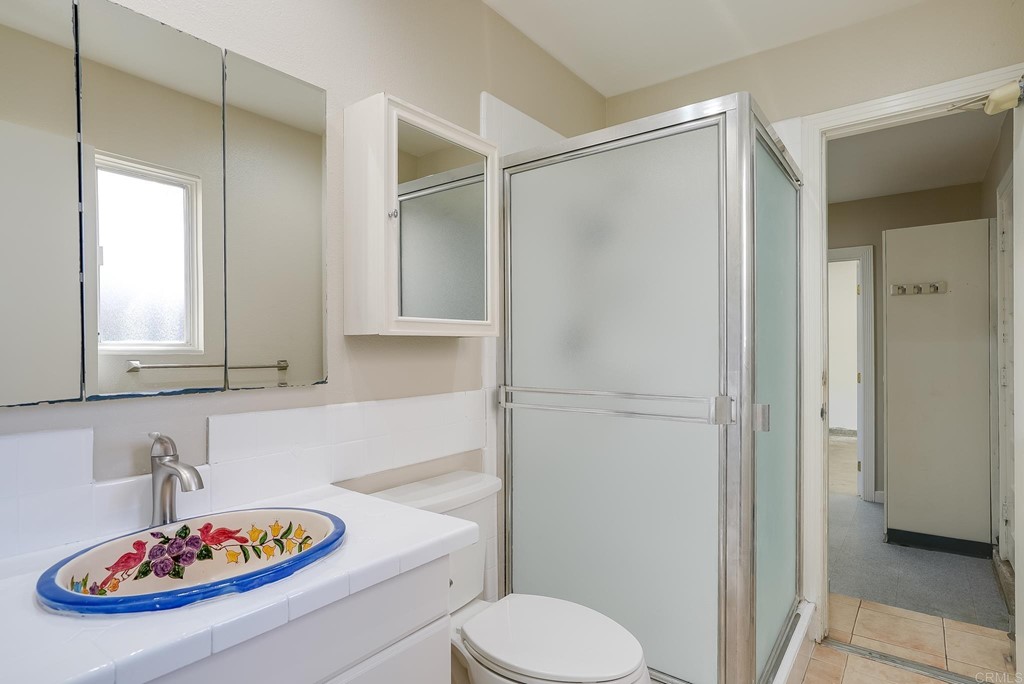 225 Hypoint Place Escondido, CA 92027 - Photo 29 of 63 a bathroom with a sink a toilet and shower