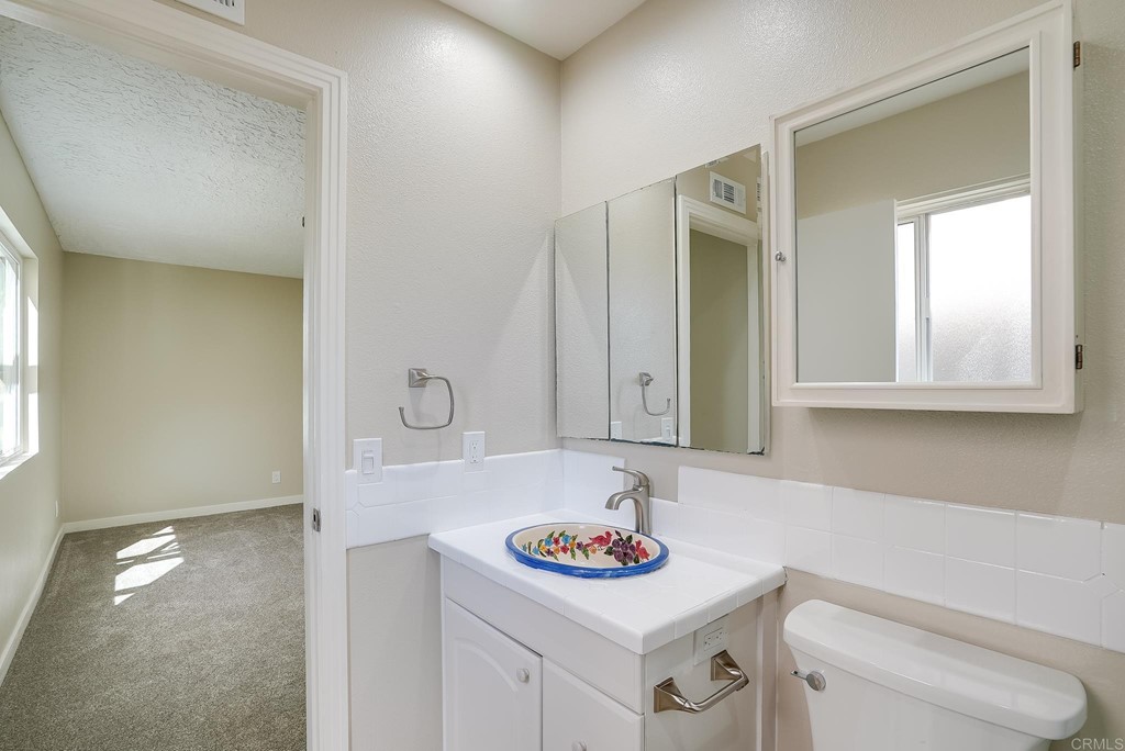 225 Hypoint Place Escondido, CA 92027 - Photo 30 of 63 a bathroom with a sink and a toilet