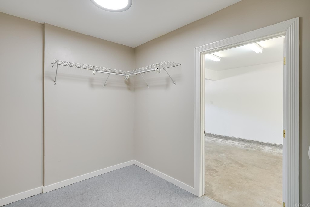 225 Hypoint Place Escondido, CA 92027 - Photo 31 of 63 a view of an empty walk in closet with empty racks