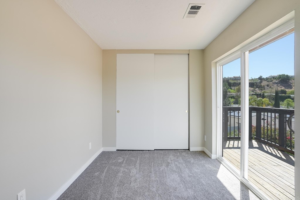225 Hypoint Place Escondido, CA 92027 - Photo 39 of 63 a view of a room with wooden floor and windows