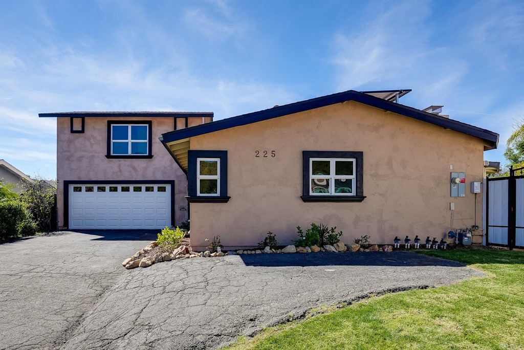 225 Hypoint Place Escondido, CA 92027 - Photo 7 of 63 a front view of a house with a yard