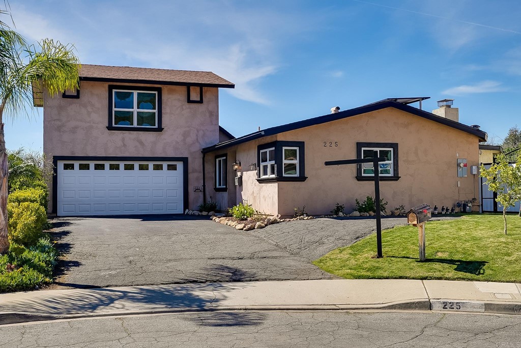 225 Hypoint Place Escondido, CA 92027 - Photo 8 of 63 a front view of a house with a yard