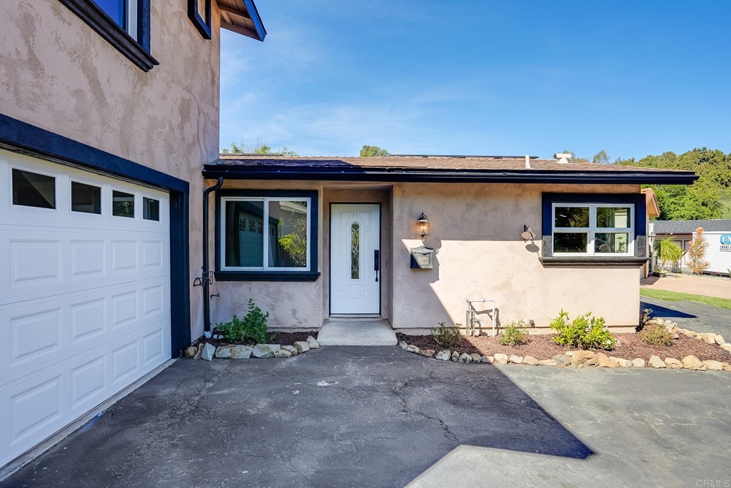 225 Hypoint Place Escondido, CA 92027 - Photo 9 of 63 a front view of a house with a garage