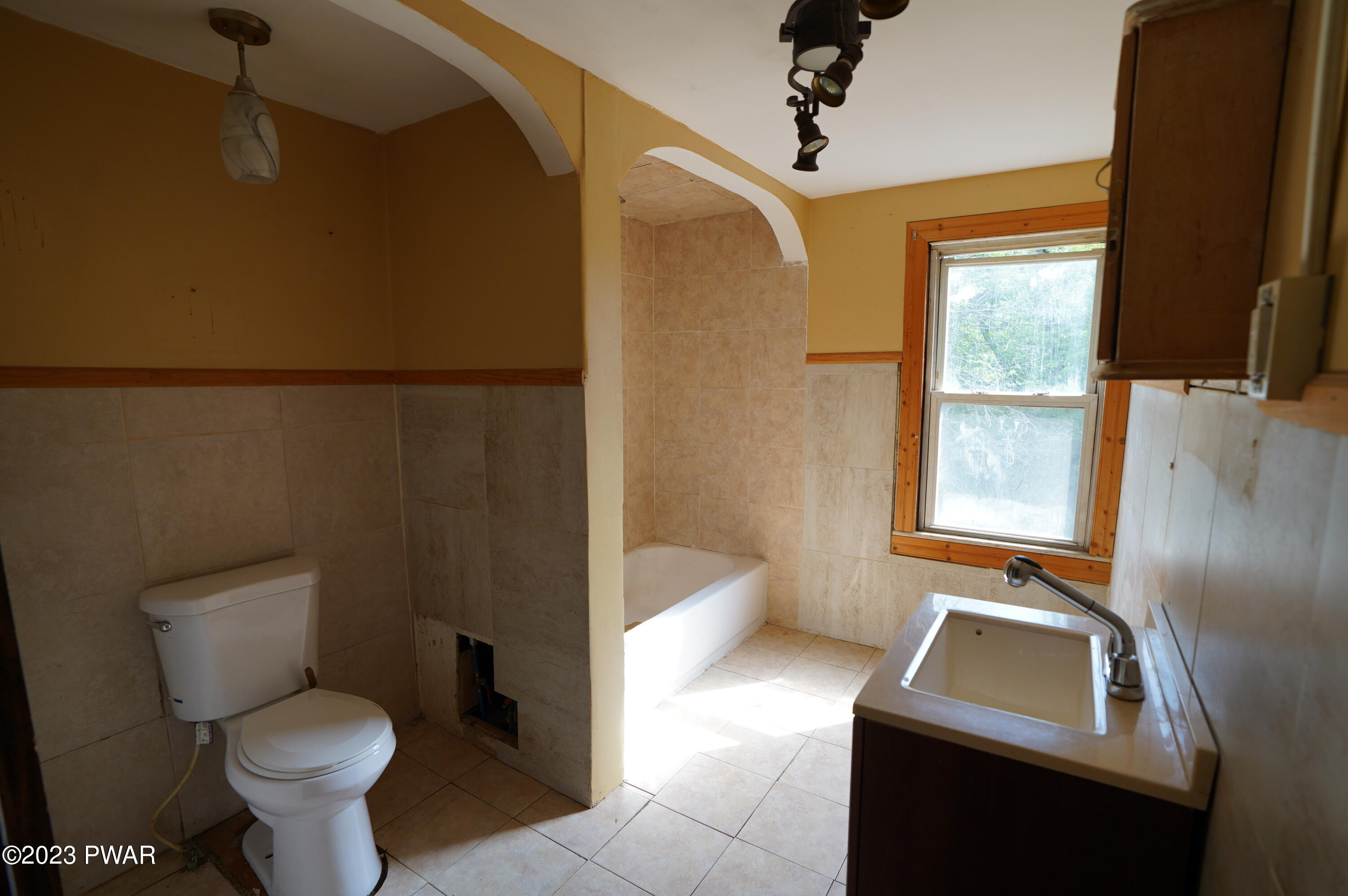 147 Daniels Road Lake Ariel, PA 18436 - Photo 10 of 25 a bathroom with a toilet sink and mirror