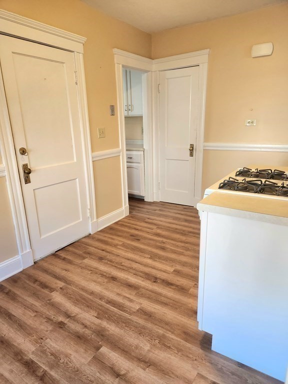 25 Glendower Road, Unit 2 Boston, MA 02131 - Photo 10 of 17 a view of a bedroom with wooden floor