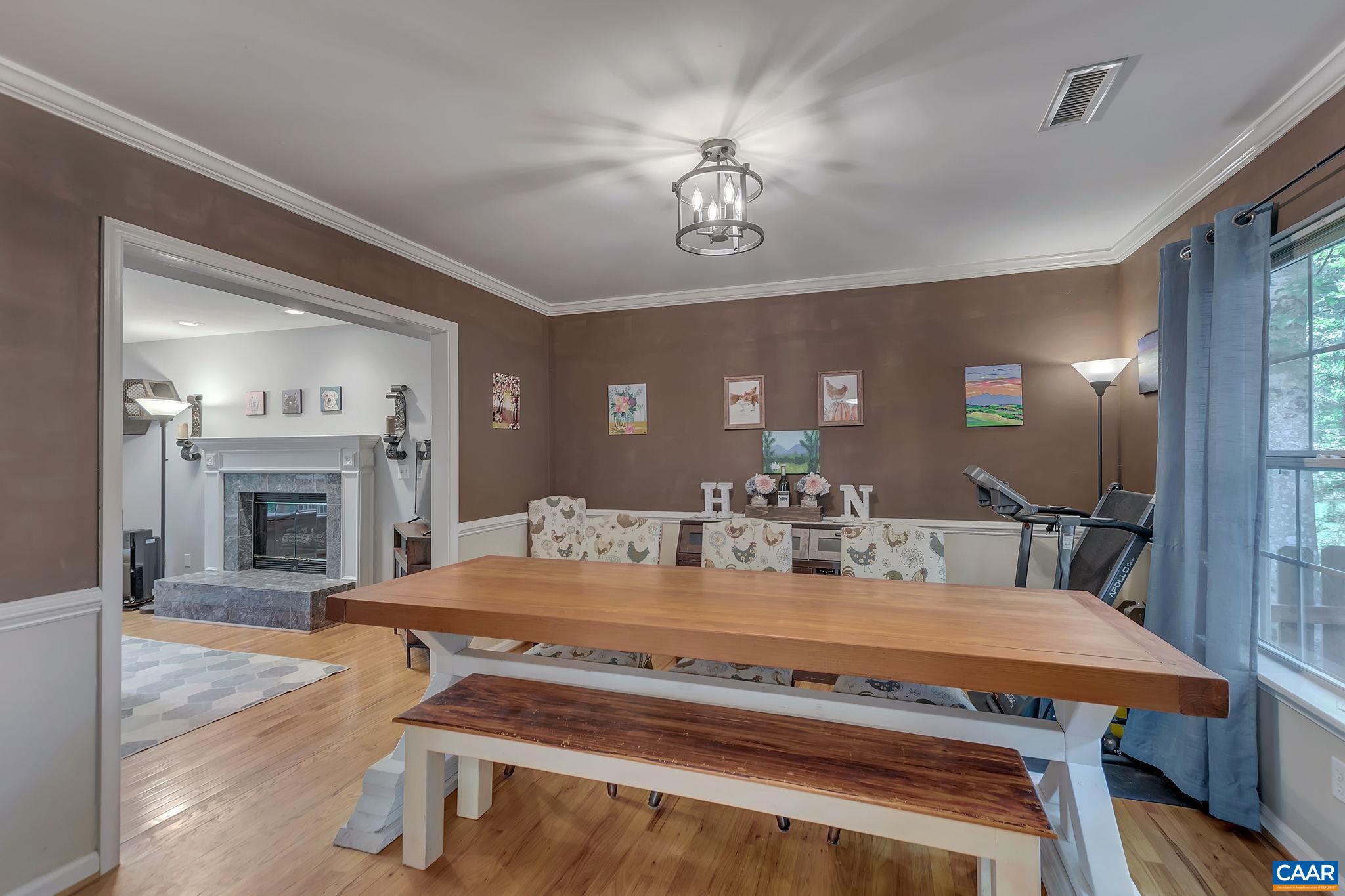 92 Riverside Drive Palmyra, VA 22963 - Photo 11 of 48 a view of a dining room with furniture a chandelier and wooden floor