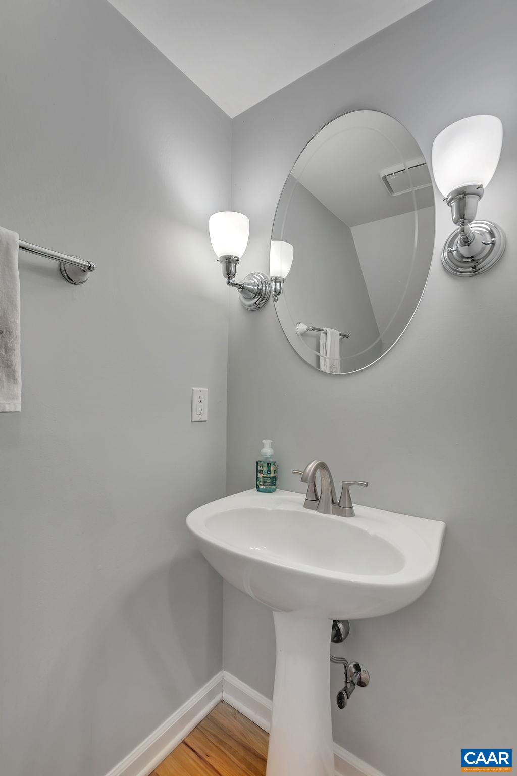 92 Riverside Drive Palmyra, VA 22963 - Photo 19 of 48 a bathroom with a sink a light fixture and a mirror