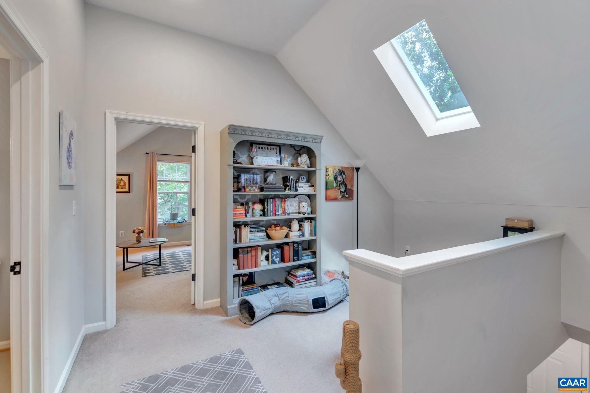 92 Riverside Drive Palmyra, VA 22963 - Photo 28 of 48 a room with a book shelf with books and white walls
