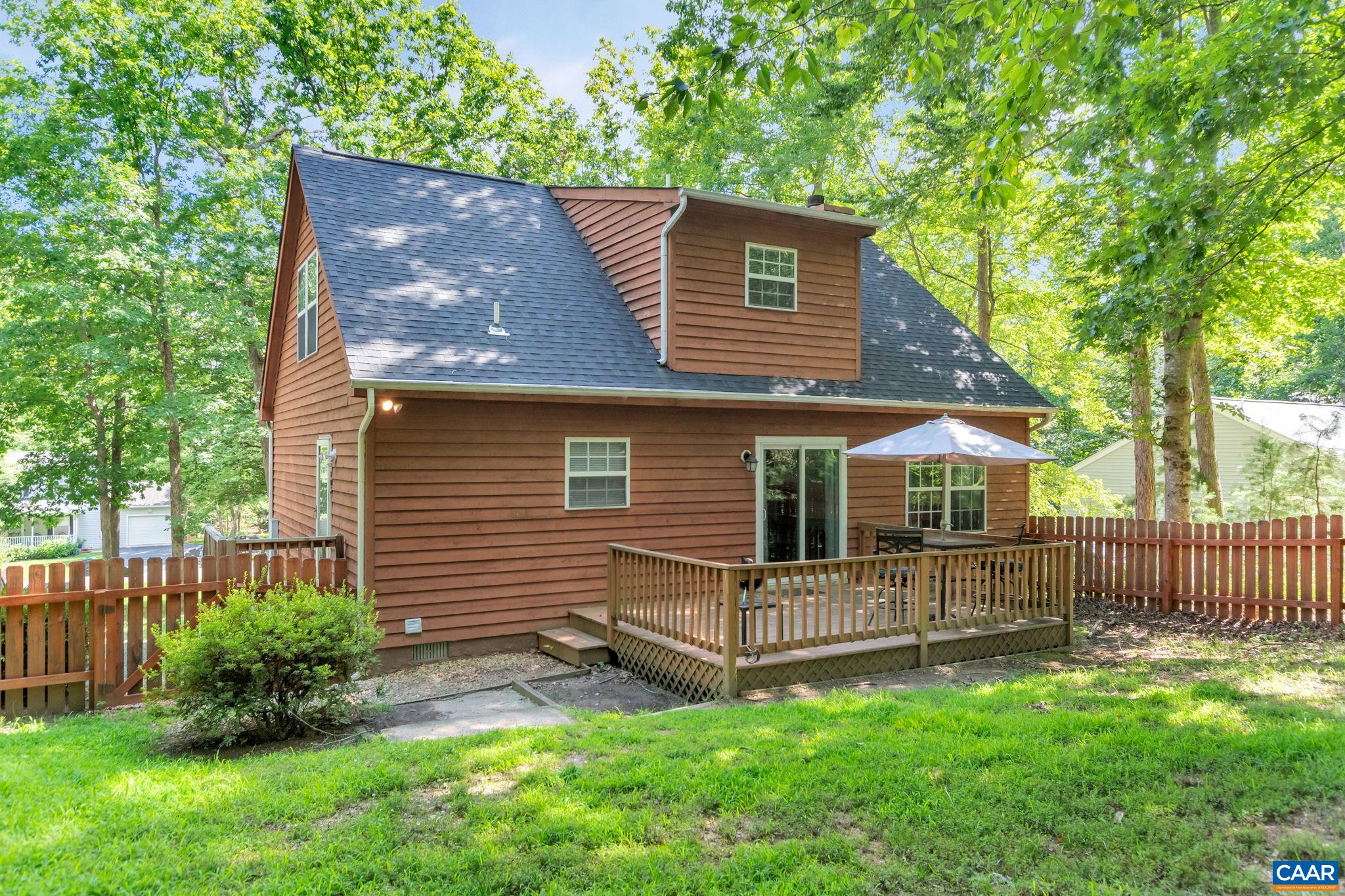 92 Riverside Drive Palmyra, VA 22963 - Photo 35 of 48 a view of backyard with a garden and deck