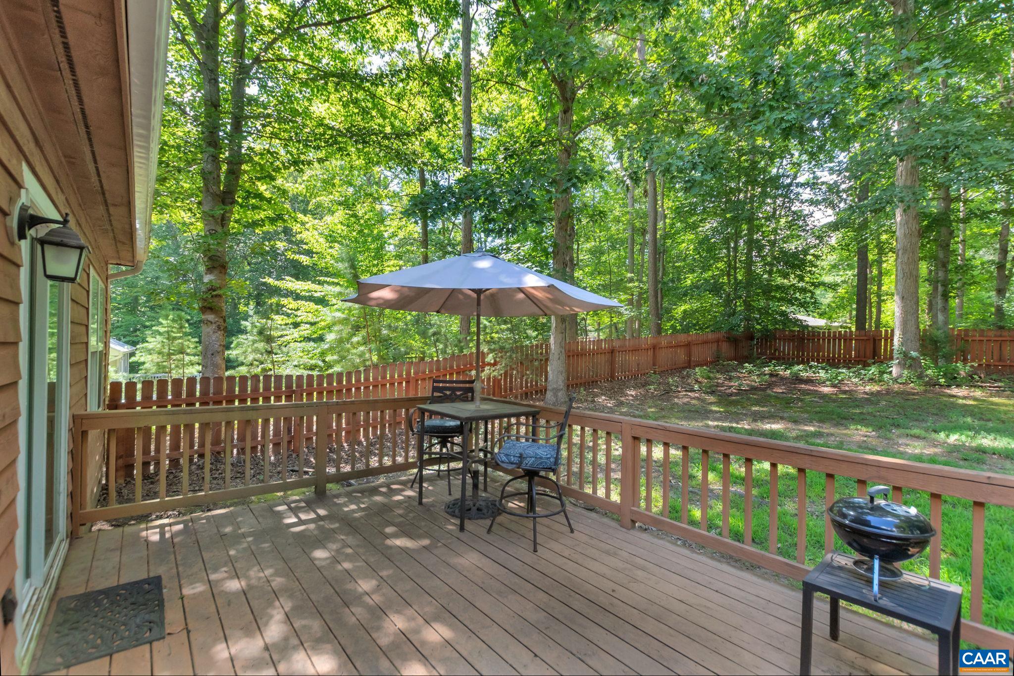 92 Riverside Drive Palmyra, VA 22963 - Photo 37 of 48 a view of a table and chairs under an umbrella