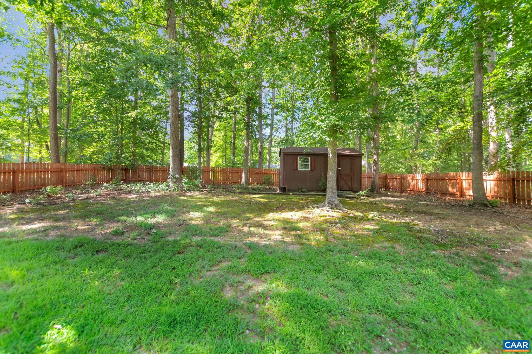 92 Riverside Drive Palmyra, VA 22963 - Photo 38 of 48 a view of a house with backyard and a tree