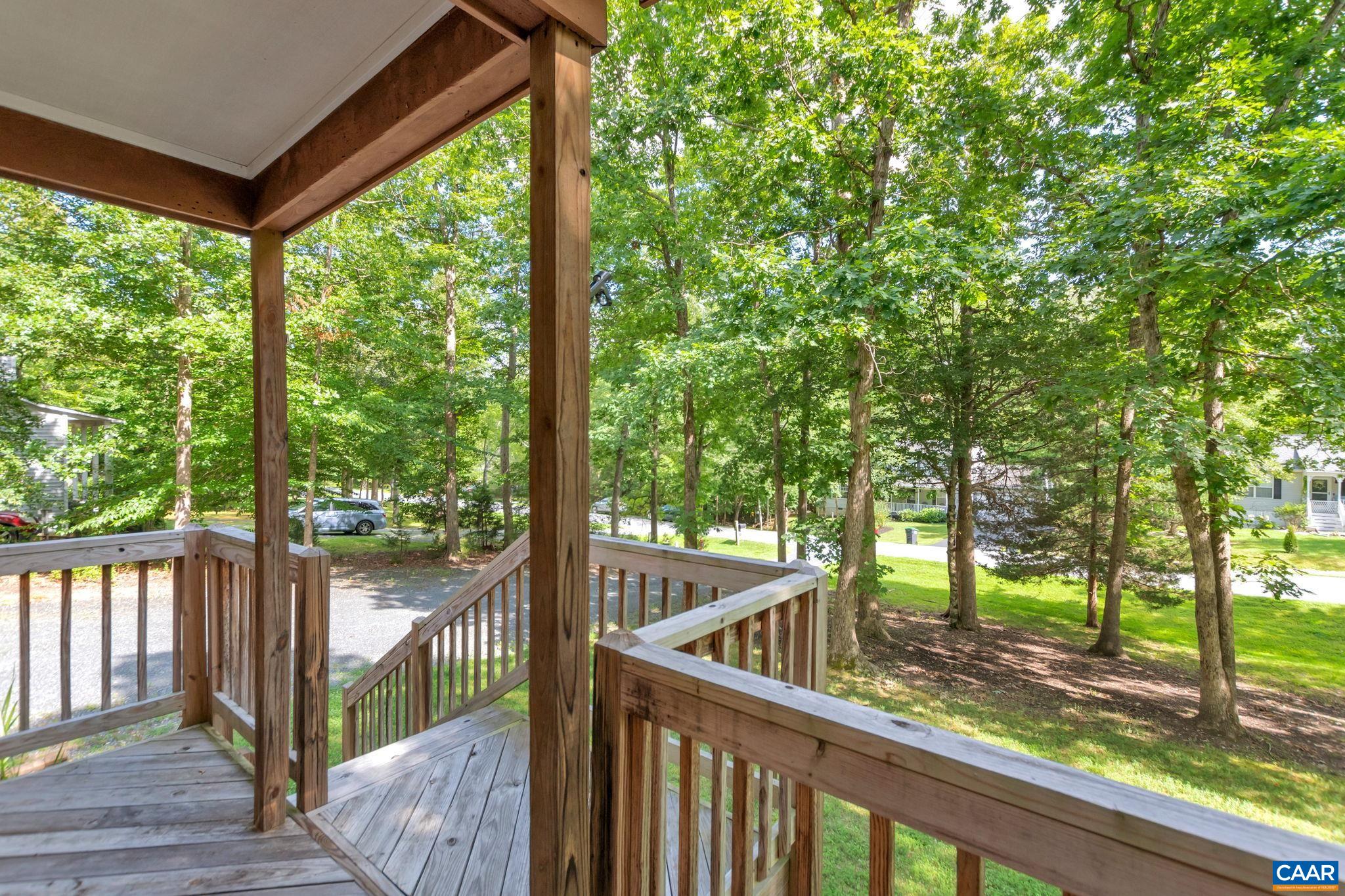 92 Riverside Drive Palmyra, VA 22963 - Photo 44 of 48 a view of a wooden deck next to a yard