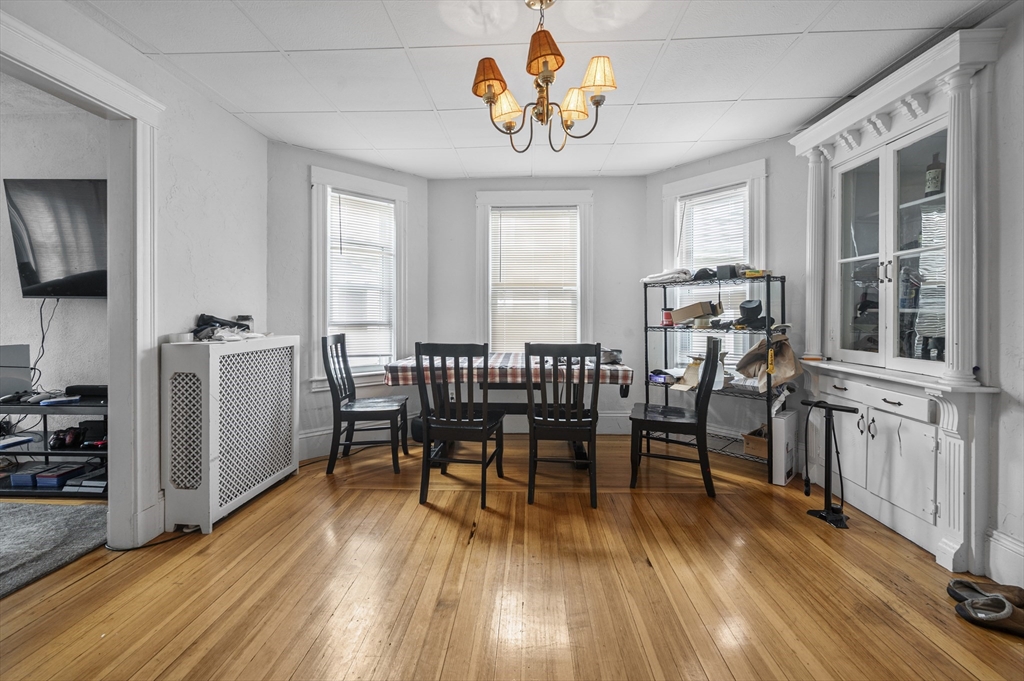 89 Central Street Somerville, MA 02143 - Photo 16 of 33 a view of a dining room with furniture window and wooden floor
