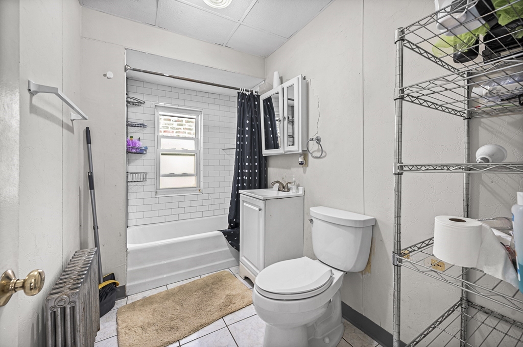 89 Central Street Somerville, MA 02143 - Photo 24 of 33 a bathroom with a toilet and a shower
