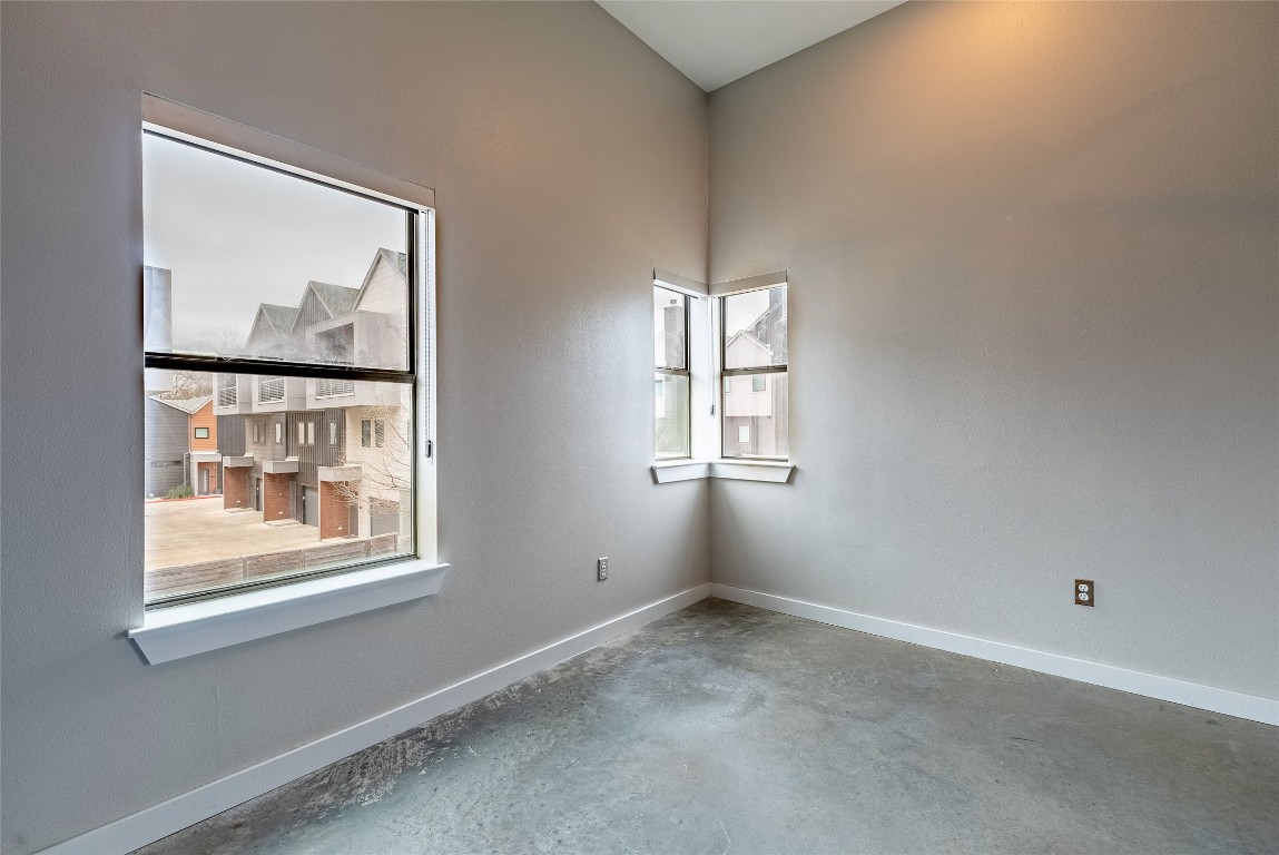 6000 South Congress Avenue, Unit 128 Austin, TX 78745 - Photo 12 of 15 an empty room with windows