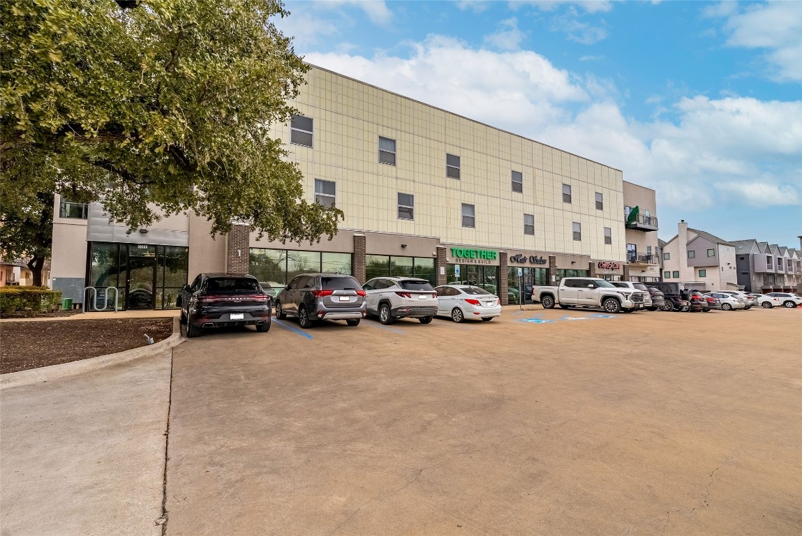 6000 South Congress Avenue, Unit 128 Austin, TX 78745 - Photo 14 of 15 a city street with cars parked in front of it