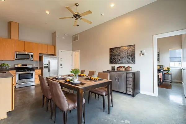 a kitchen with a table and chairs in it