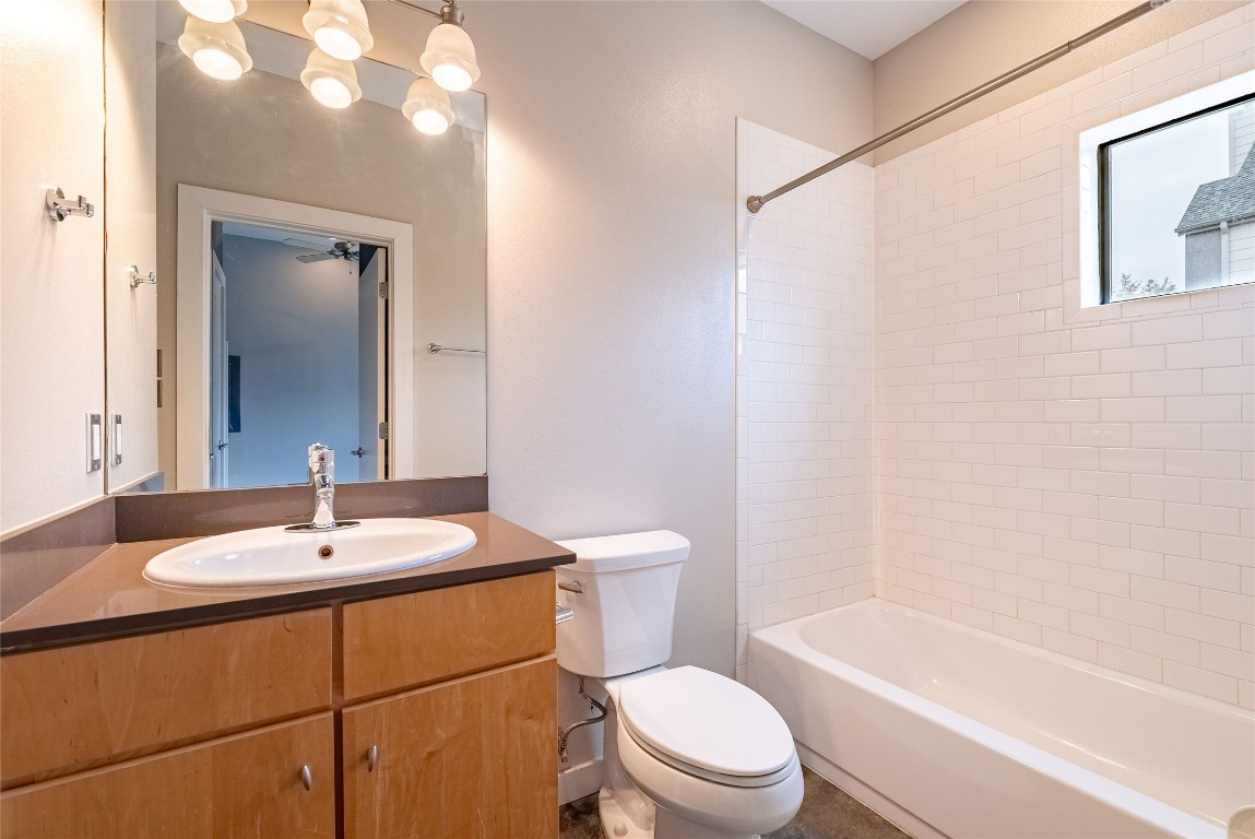6000 South Congress Avenue, Unit 128 Austin, TX 78745 - Photo 10 of 15 a bathroom with a sink a toilet and shower