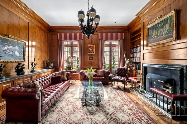 a view of a dining room and hall with furniture