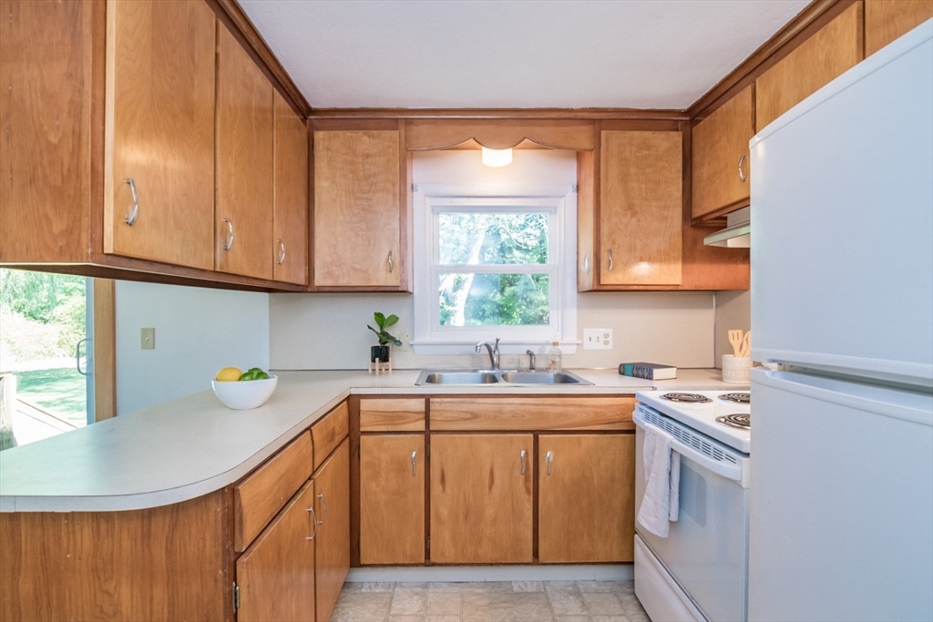 40 Farmington Road Amherst, MA 01002 - Photo 13 of 26 a kitchen with a sink a window and cabinets