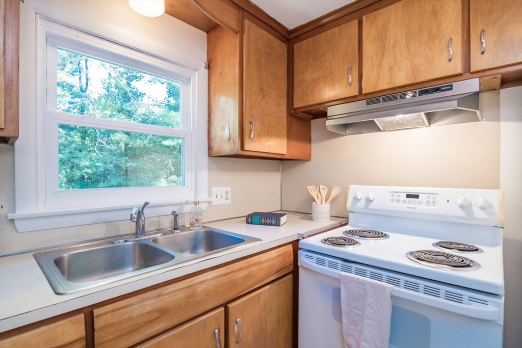 40 Farmington Road Amherst, MA 01002 - Photo 14 of 26 a kitchen with a sink stove top oven and cabinets