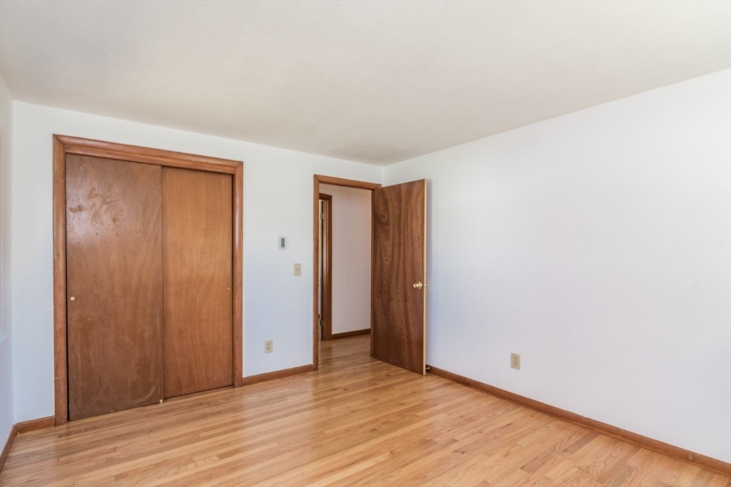 40 Farmington Road Amherst, MA 01002 - Photo 20 of 26 a view of an empty room with wooden floor