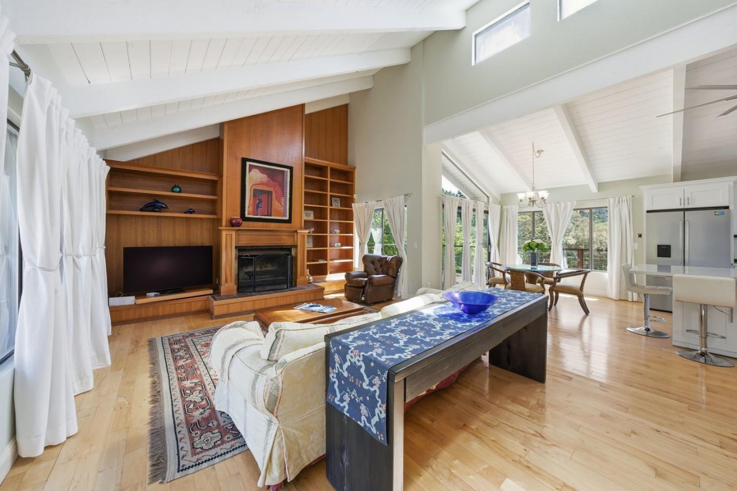 701 Day Valley Road Aptos, CA 95003 - Photo 13 of 43 a bed room with furniture and a fireplace