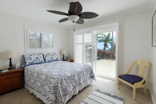 a bedroom with a bed and a chair