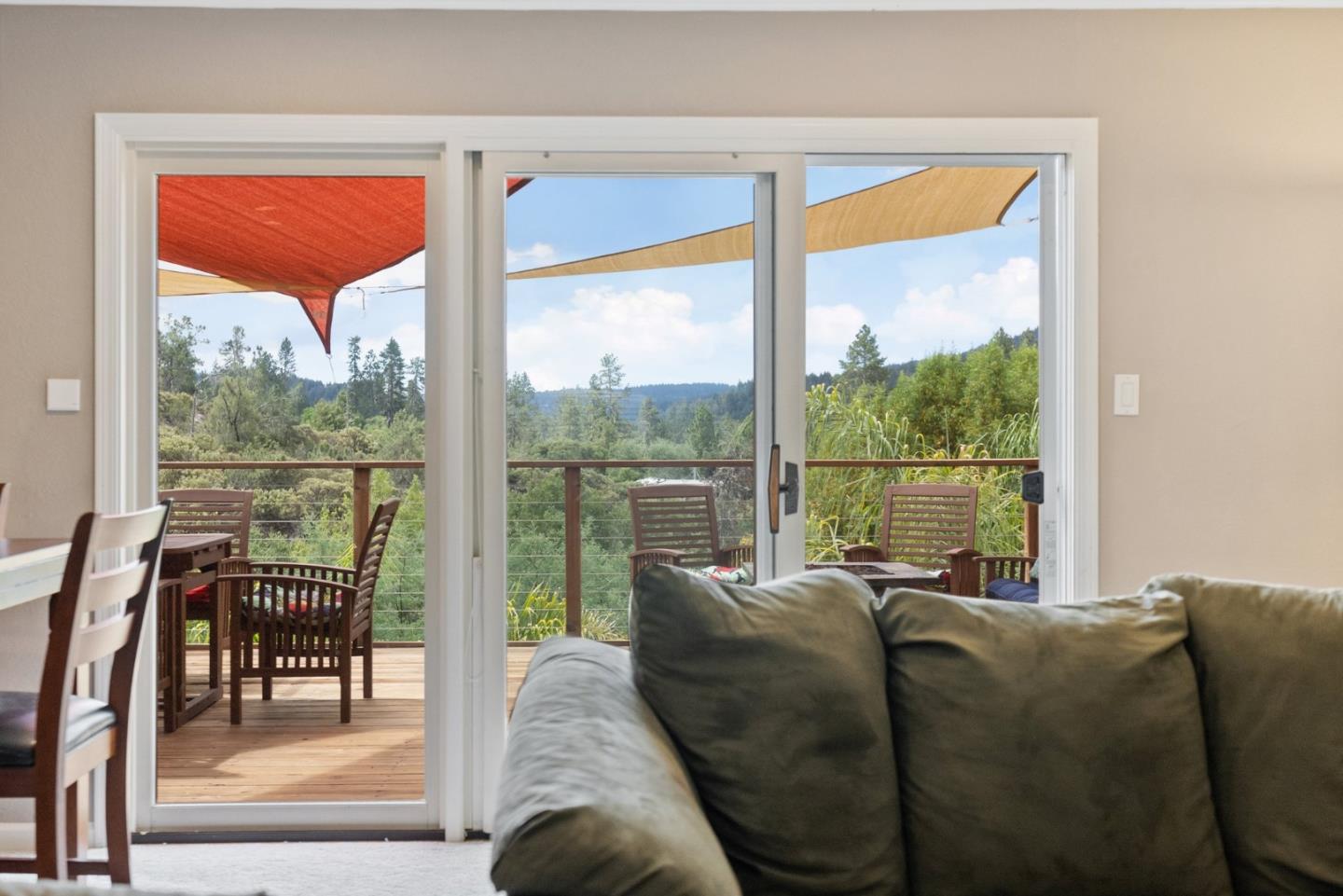 270 Estates Drive Ben Lomond, CA 95005 - Photo 29 of 61 a living room with couch chairs and a floor to ceiling window