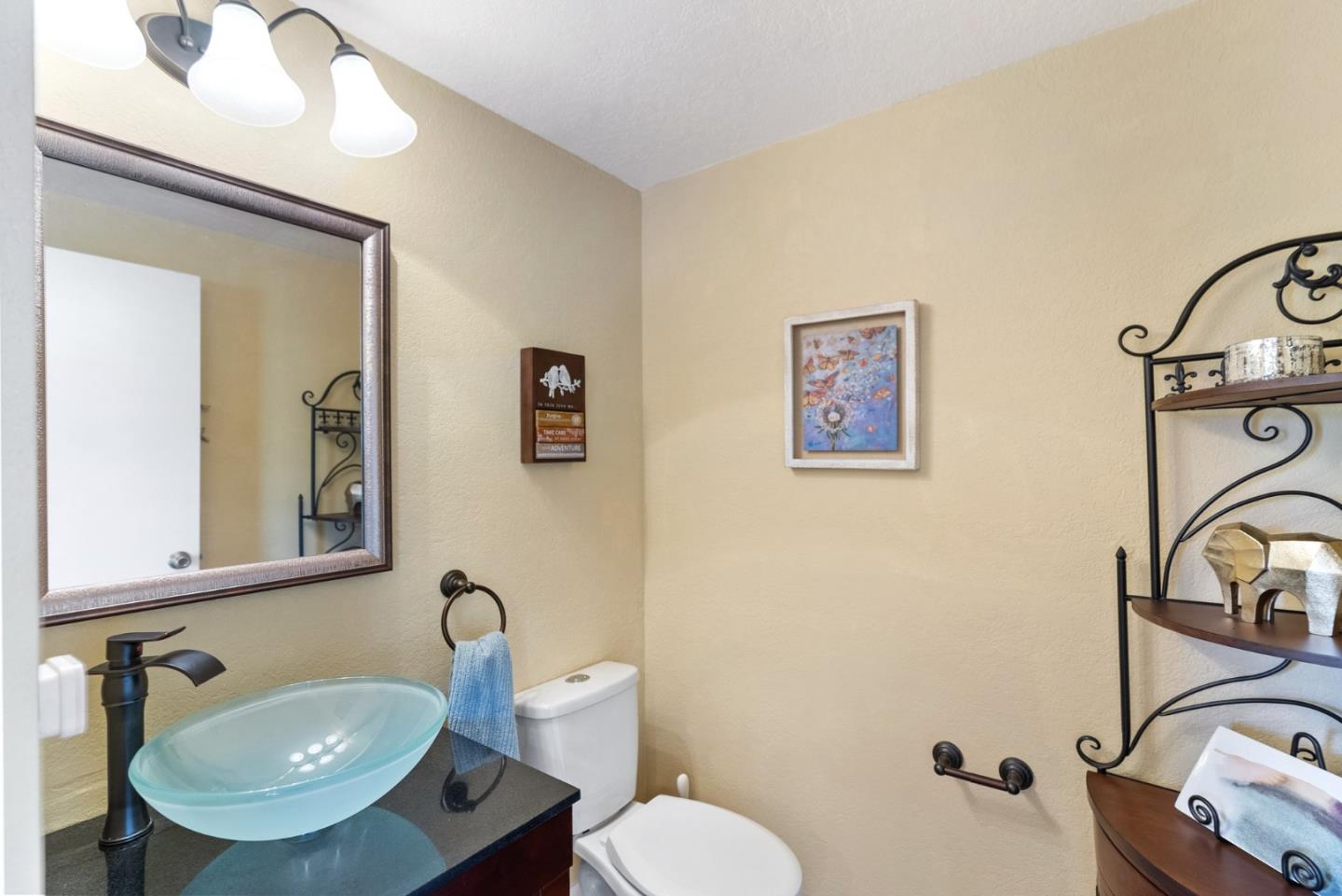270 Estates Drive Ben Lomond, CA 95005 - Photo 37 of 61 a bathroom with a sink mirror and toilet