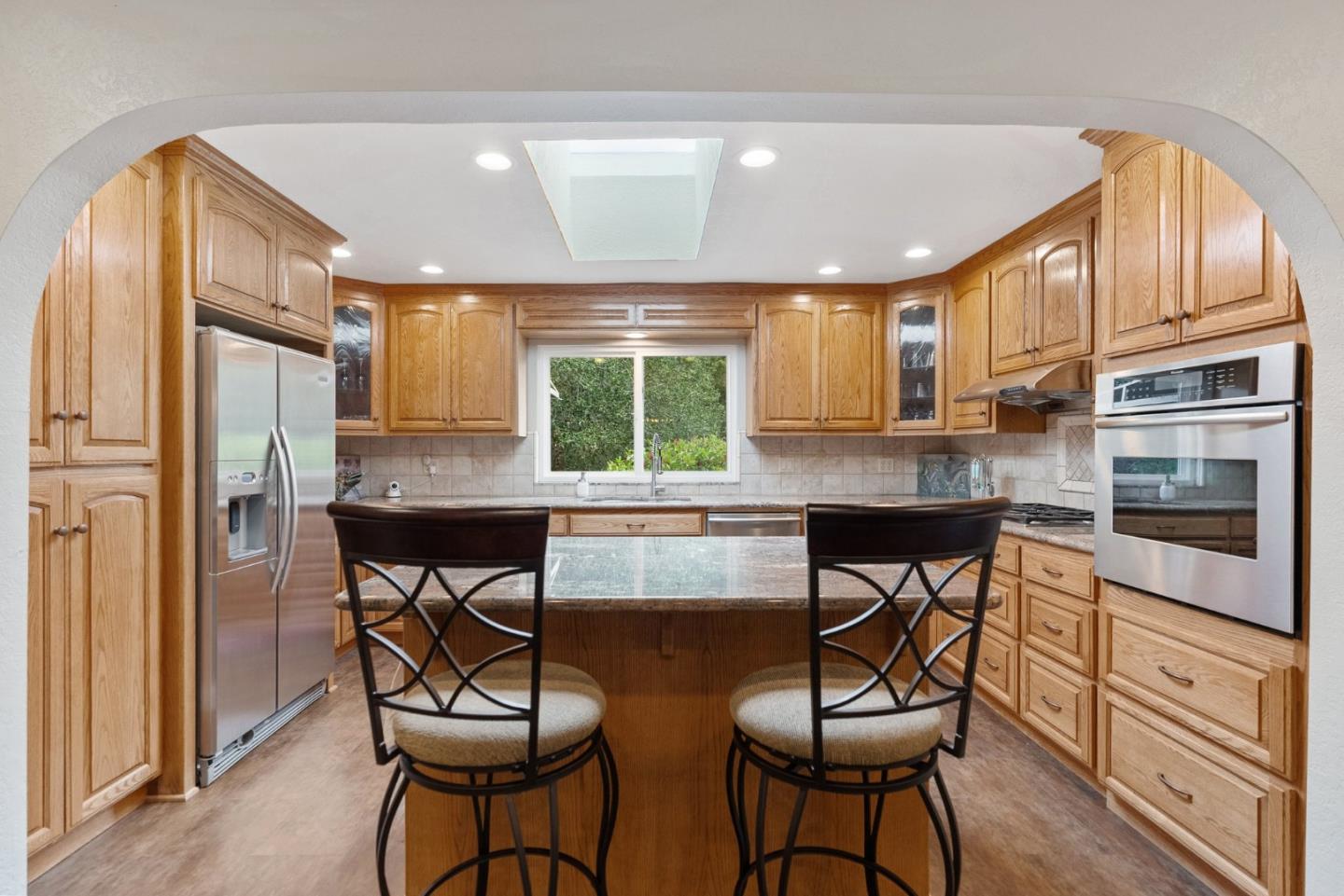 270 Estates Drive Ben Lomond, CA 95005 - Photo 55 of 61 a kitchen with stainless steel appliances granite countertop a stove a refrigerator and a refrigerator