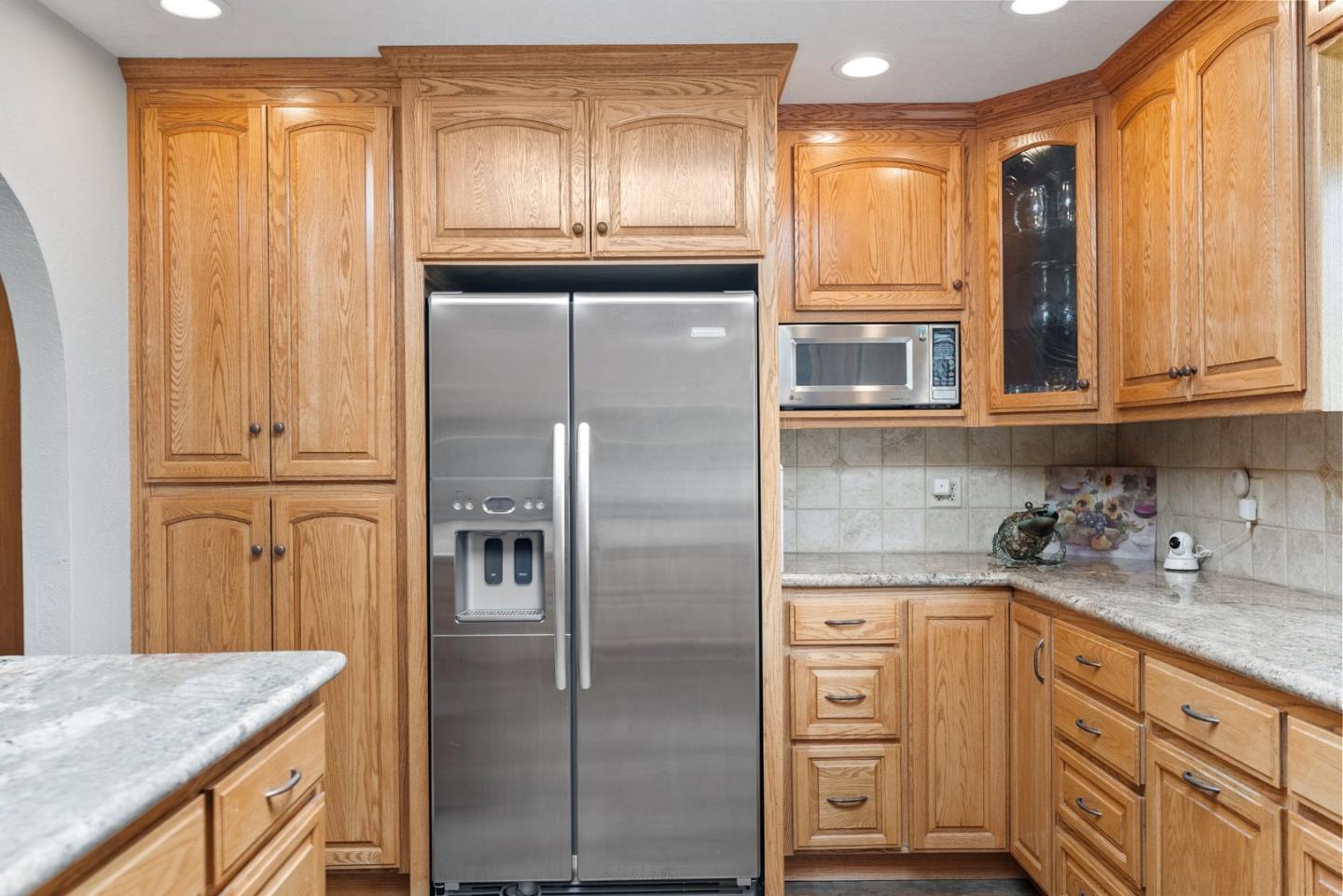 270 Estates Drive Ben Lomond, CA 95005 - Photo 56 of 61 a kitchen with granite countertop stainless steel appliances a refrigerator and cabinets