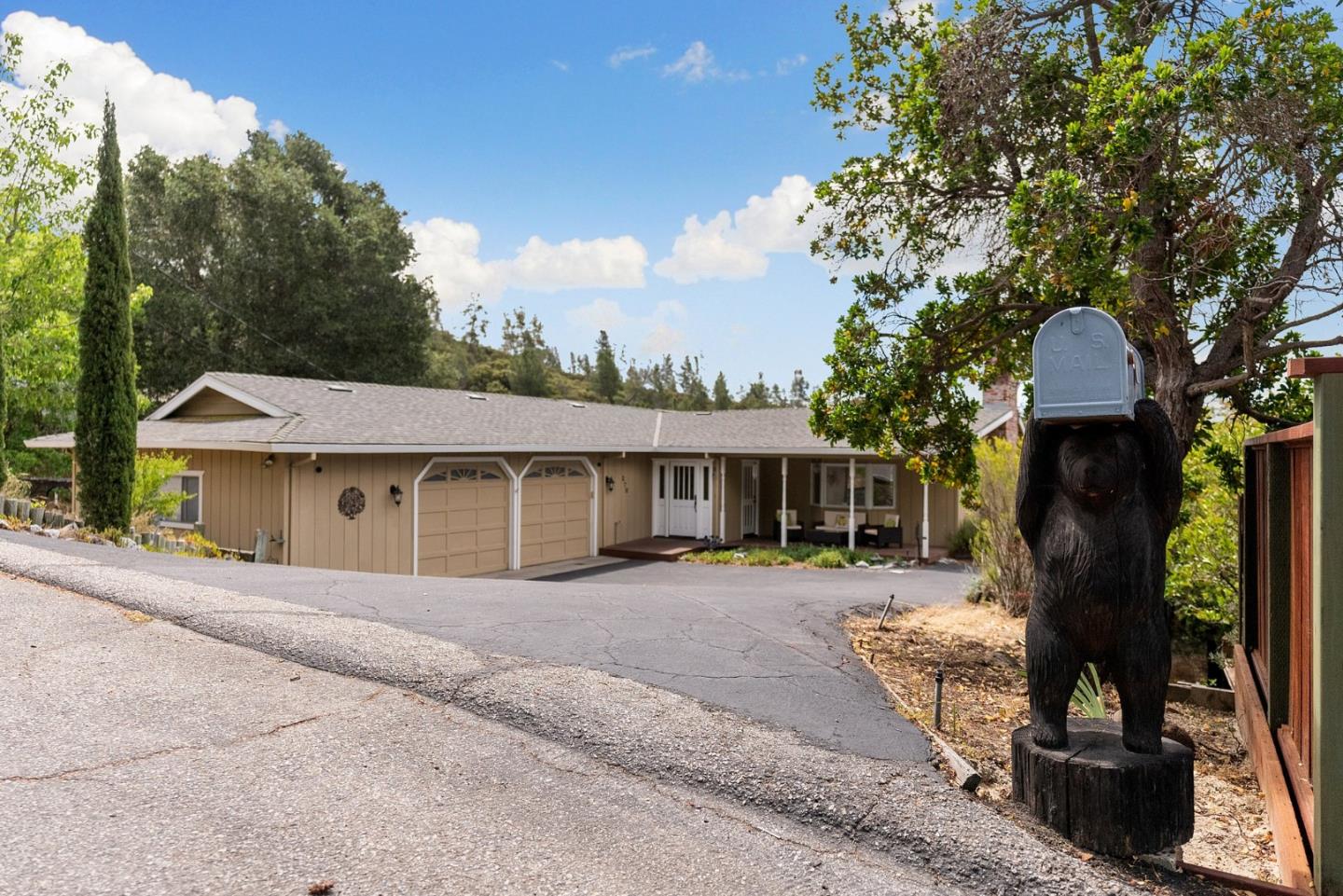 270 Estates Drive Ben Lomond, CA 95005 - Photo 6 of 61 a front view of a house with a yard and potted plants