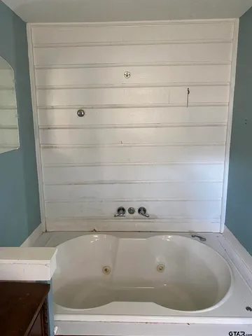 a view of a door and an empty room