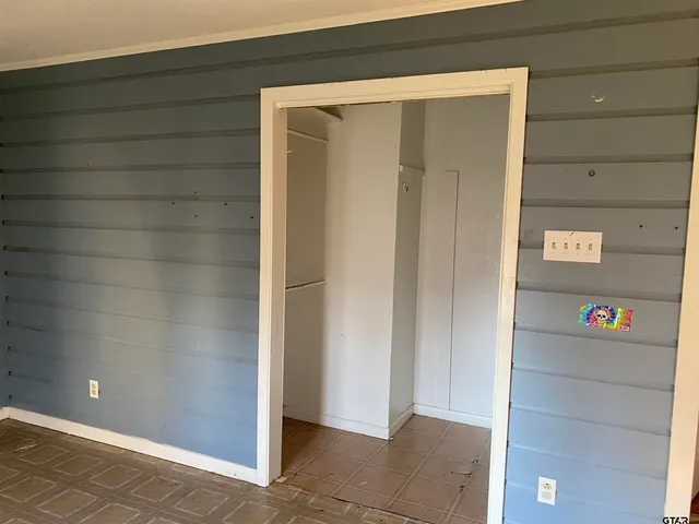 a room with a window and wooden floor