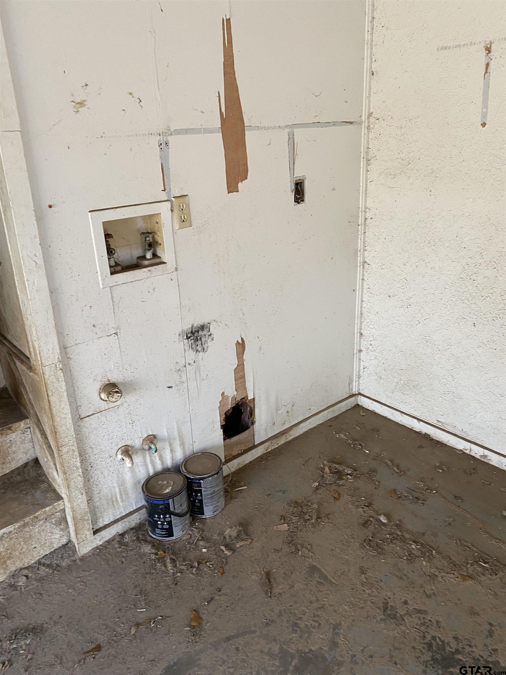 210 North Stephens Street Quitman, TX 75783 - Photo 25 of 28 a view of a room with racks on the wall