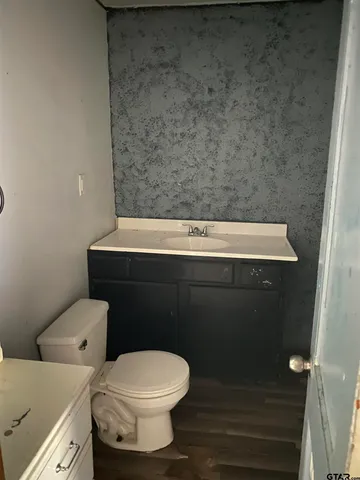 a bathroom with a toilet and a sink