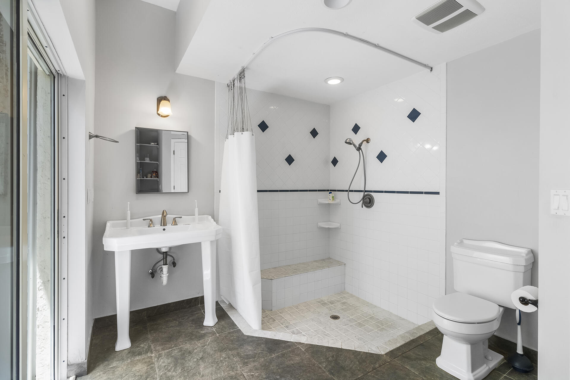 298 Northwest 11th Street Boca Raton, FL 33432 - Photo 15 of 21 a bathroom with a toilet sink and shower
