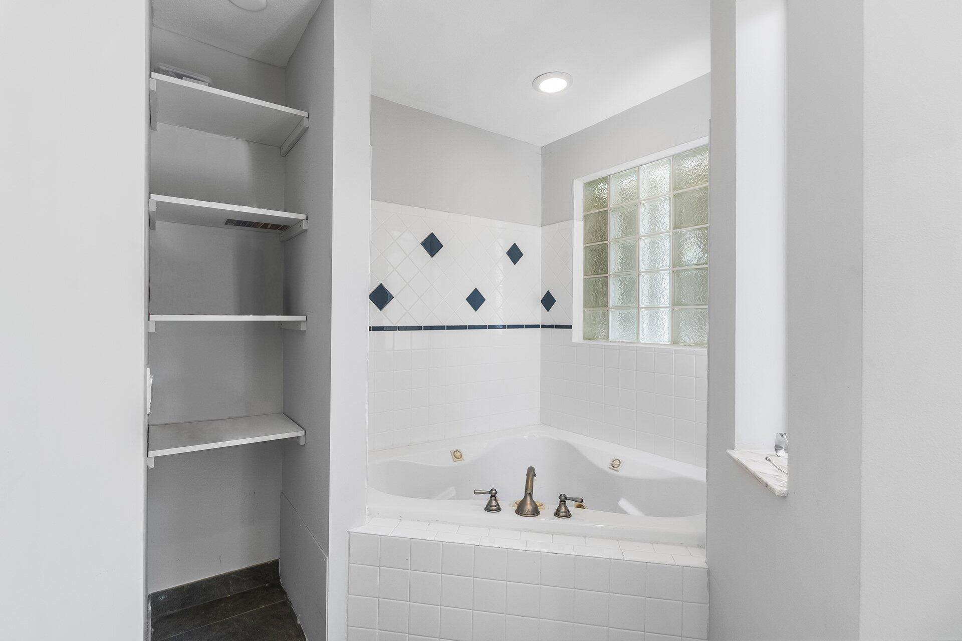 298 Northwest 11th Street Boca Raton, FL 33432 - Photo 16 of 21 a bathroom with a bathtub and a sink
