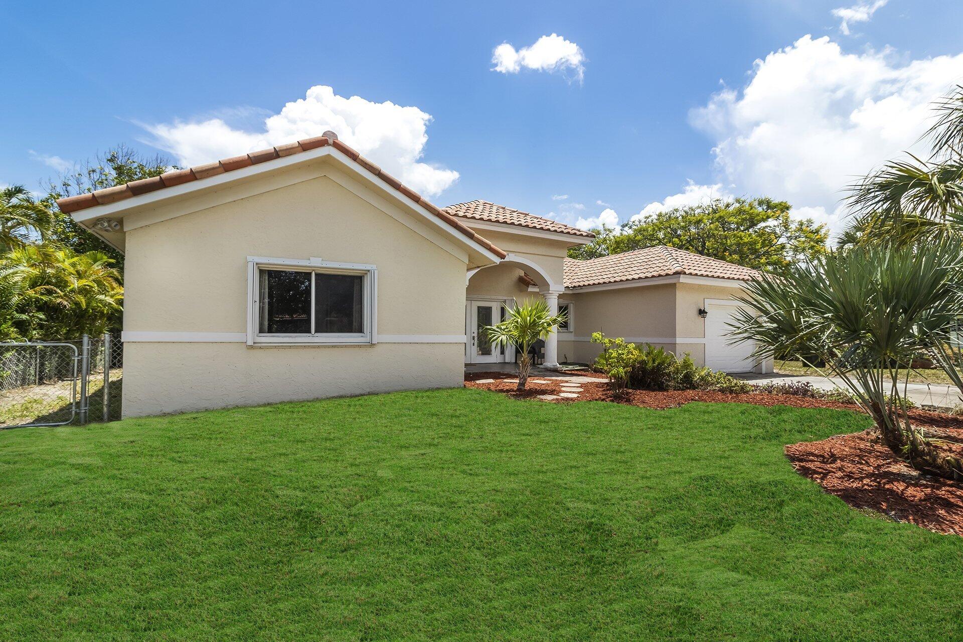 298 Northwest 11th Street Boca Raton, FL 33432 - Photo 21 of 21 a house view with a garden space